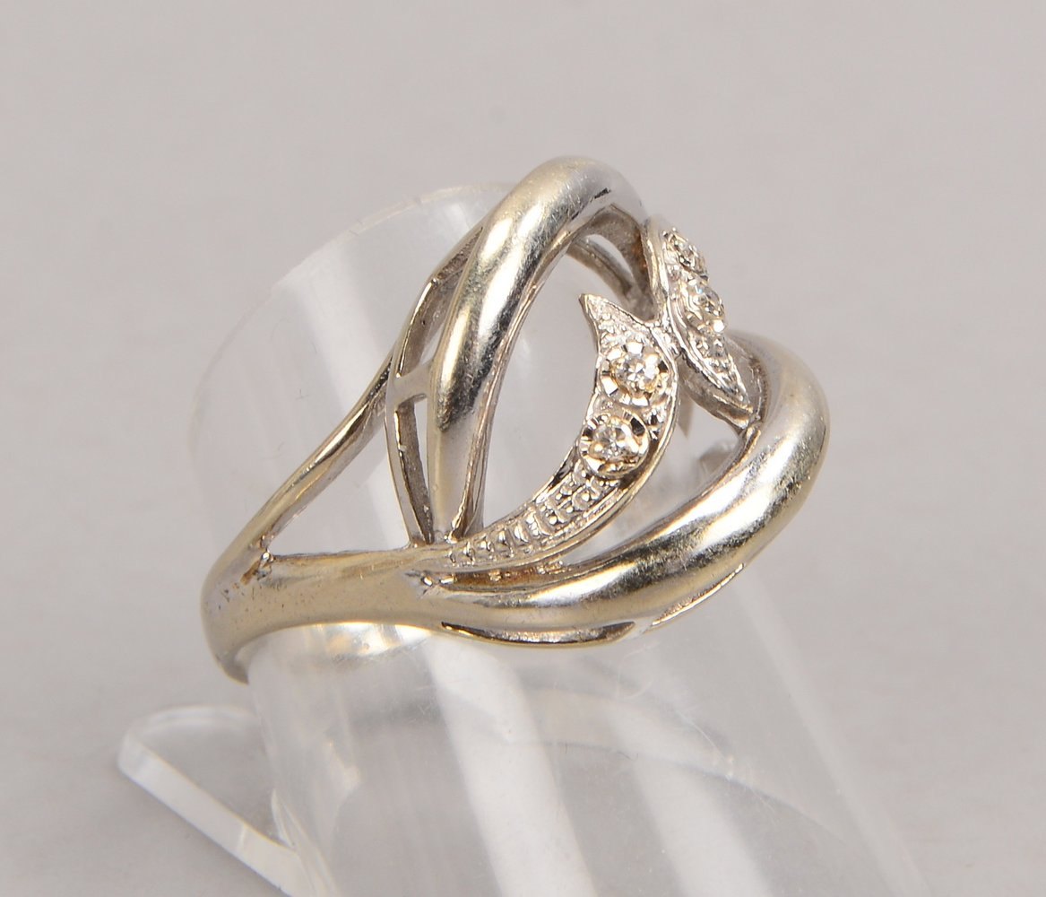 Ring (Juweliersarbeit), 585 WG (gest.), mit 4x kl. Diamanten/zus. ca. 0,10 ct
