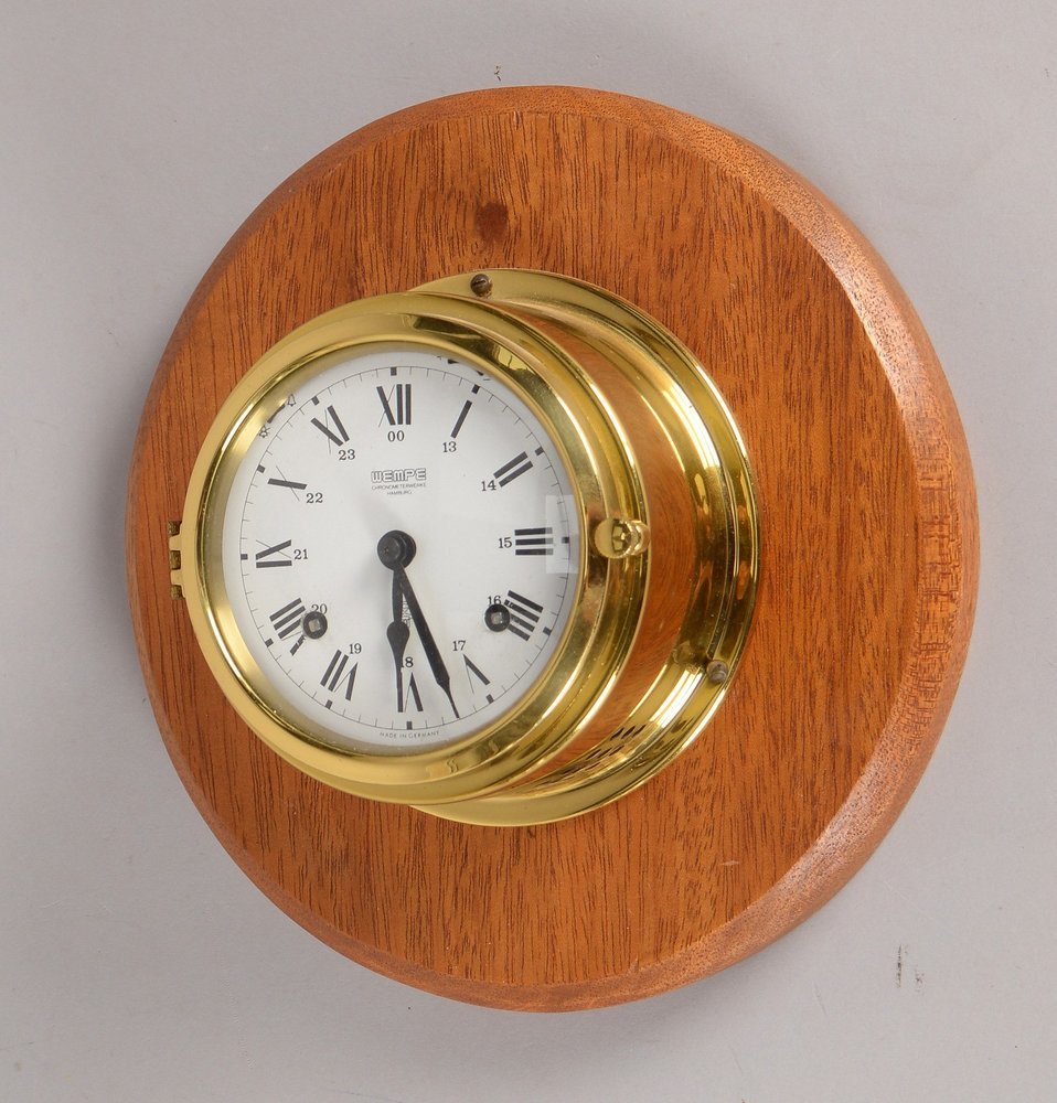 Sammlerstück: Wanduhr/Schiffsuhr, Messinggehäuse an Mahagoniplatte mont.