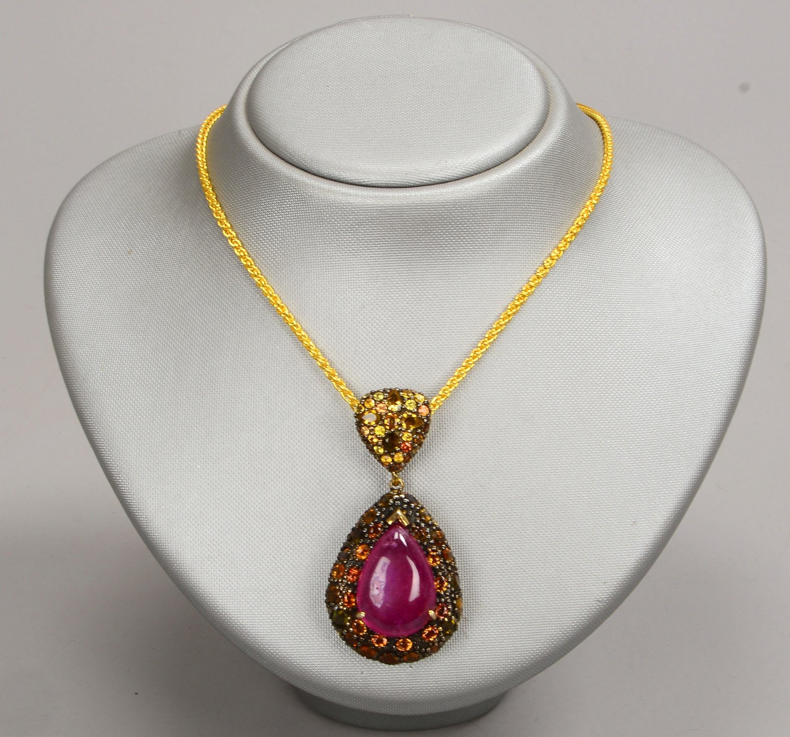 Collier, Silber/teils vergoldet, mit Rubin/38,5 ct und orangefarb. Saphiren/12,45 ct