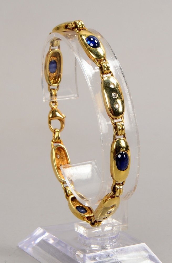 Armband, 585 GG (gest), ovale Glieder, mit kl. Diam.- und Saphir-Cabochons/altern.