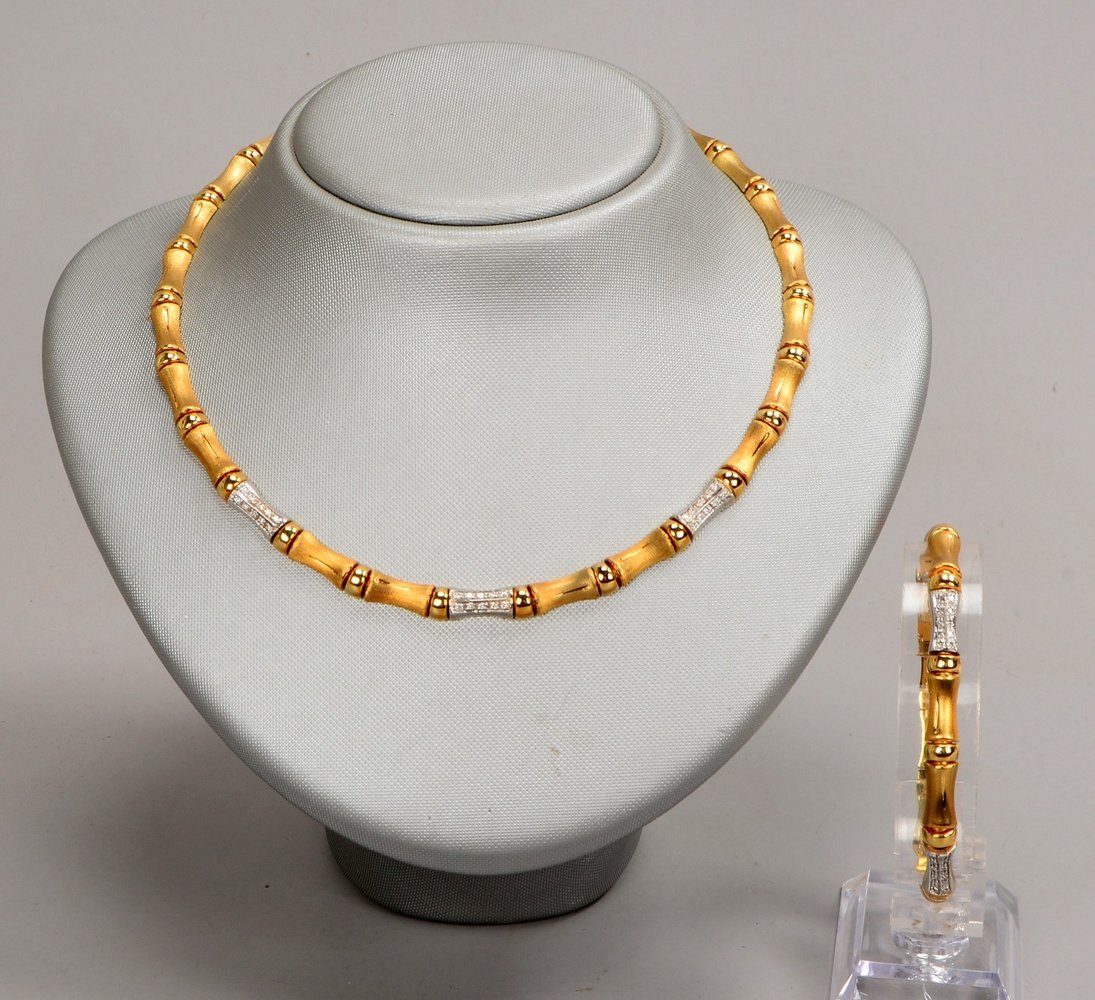 Schmuckset, 585 GG (gest.), Glieder teils mit Diam./zus. 0,60 ct: Collier und Armband