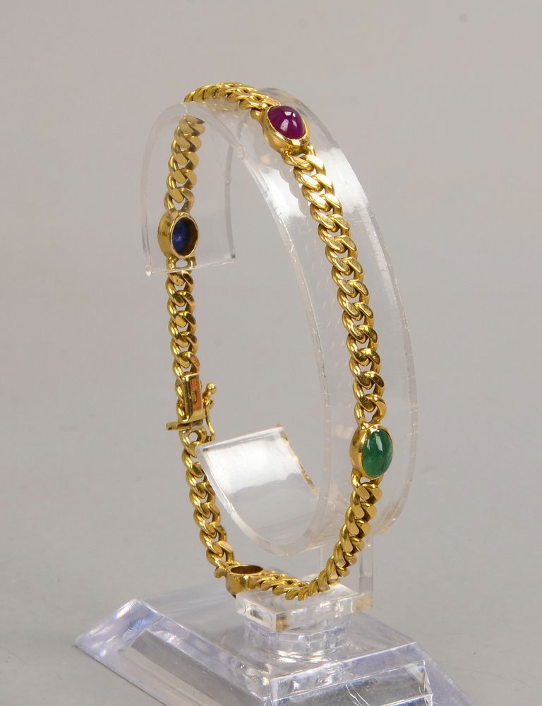 Panzerarmband, 585 GG (gest.), mit 2x Saphiren sowie je 1 Smaragd und Rubin; Gew. 14,15 g