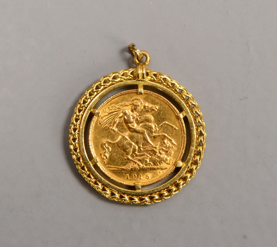 Anhänger, 750 GG-Fassung, mit engl. Münze, '1/2 Sovereign, 1915'; Ges.gew. 10,40 g