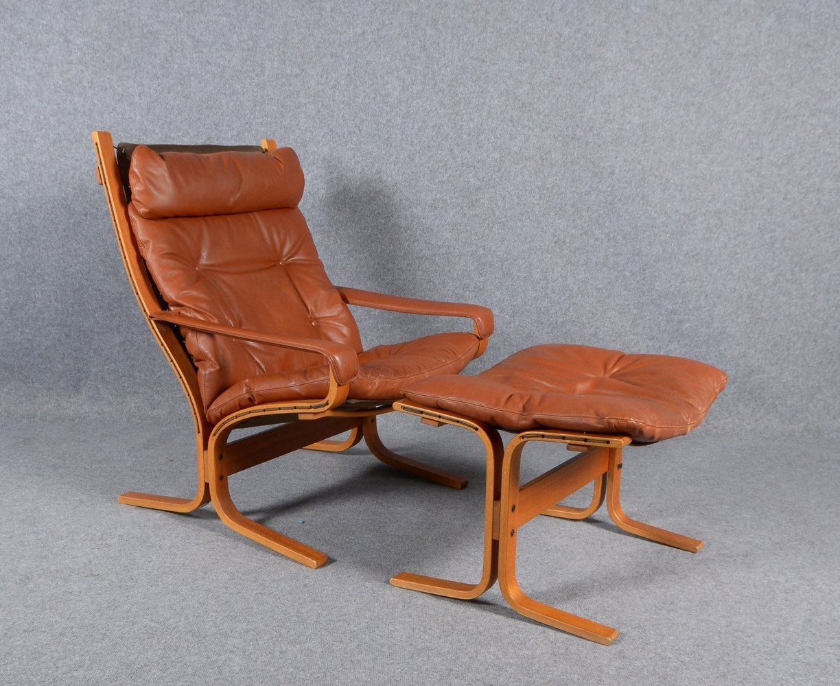 Westnofa, Siesta-Sessel, Schichtholz mit Stoffbezug/Leder-Polster in Braun, mit Hocker