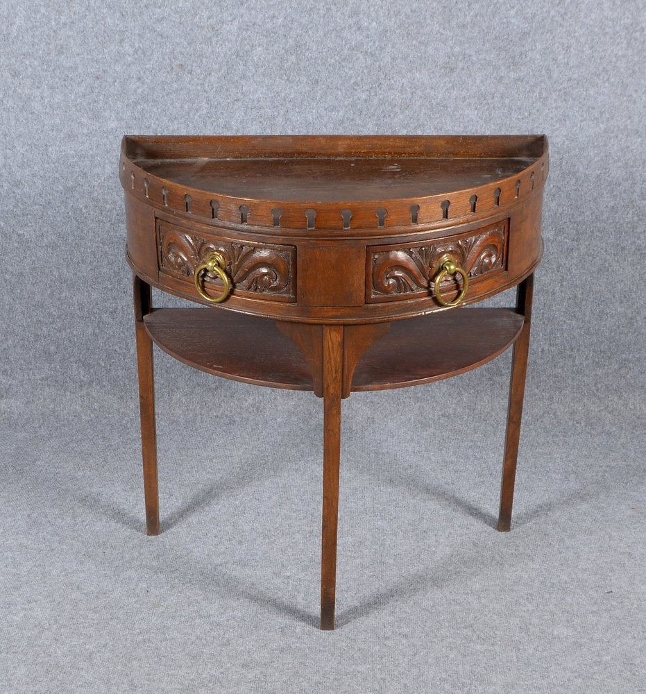 Konsolentisch, halbrund, 2-schübig, mit Ablage/Balustrade, teils beschnitzt; Höhe 78 cm