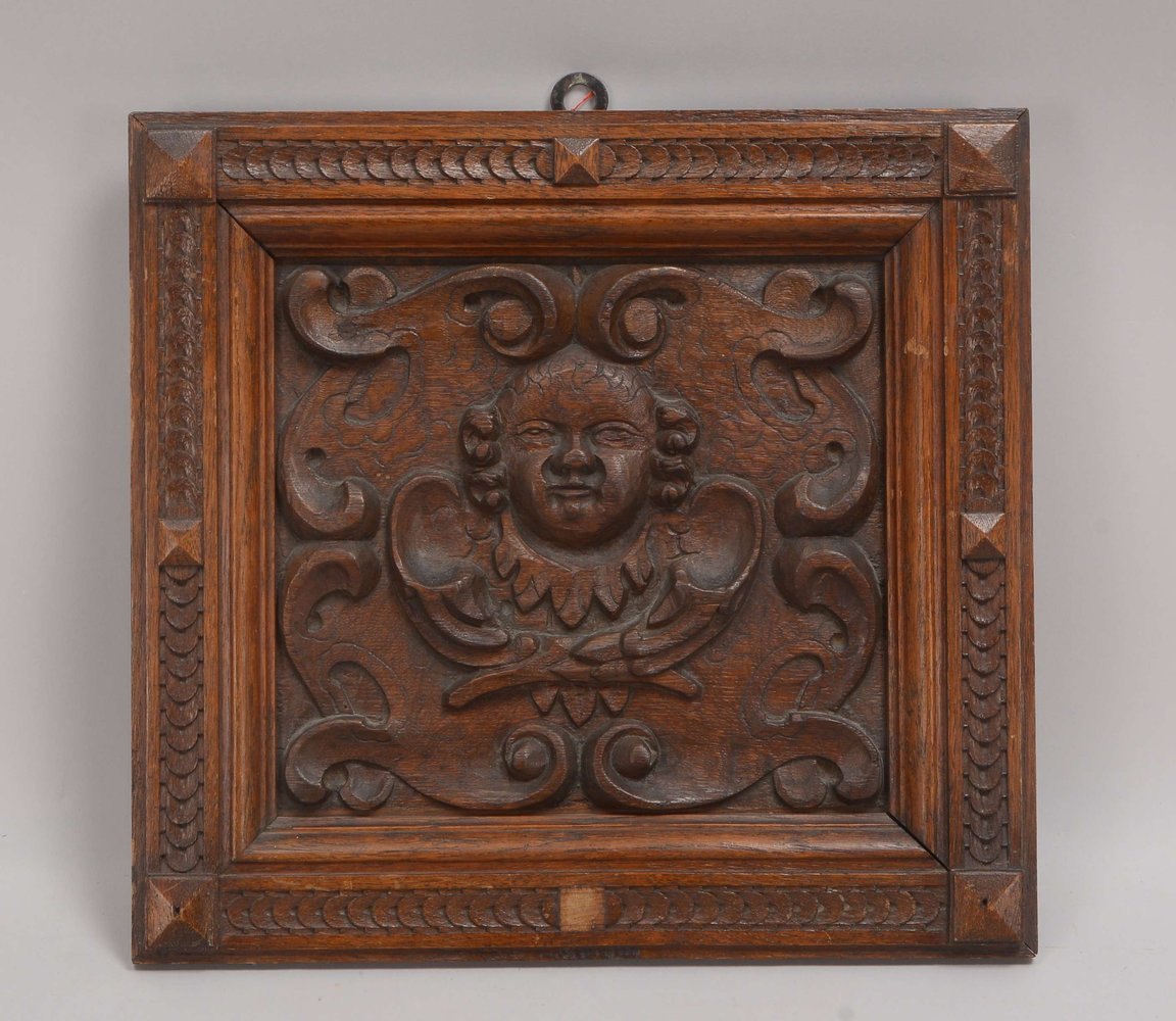 Holzrelief/Kassette, Eiche, 'Putto-Kopf', gerahmt; Rahmenmaße 35 x 37 cm