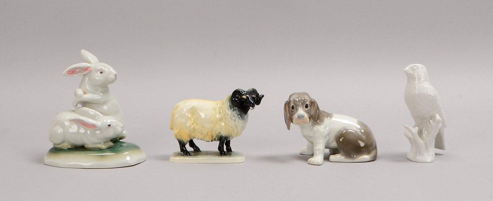4 Porz.-/Keramikfiguren (u.a. KPM): 'Vogel, 'Schaf', 'Welpe', und 'Hasenpaar'