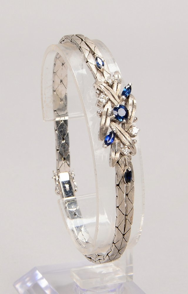 Armband, 585 WG (gest.), mit 5x Saphiren und 4x kl. Brill., mit Steckschließe