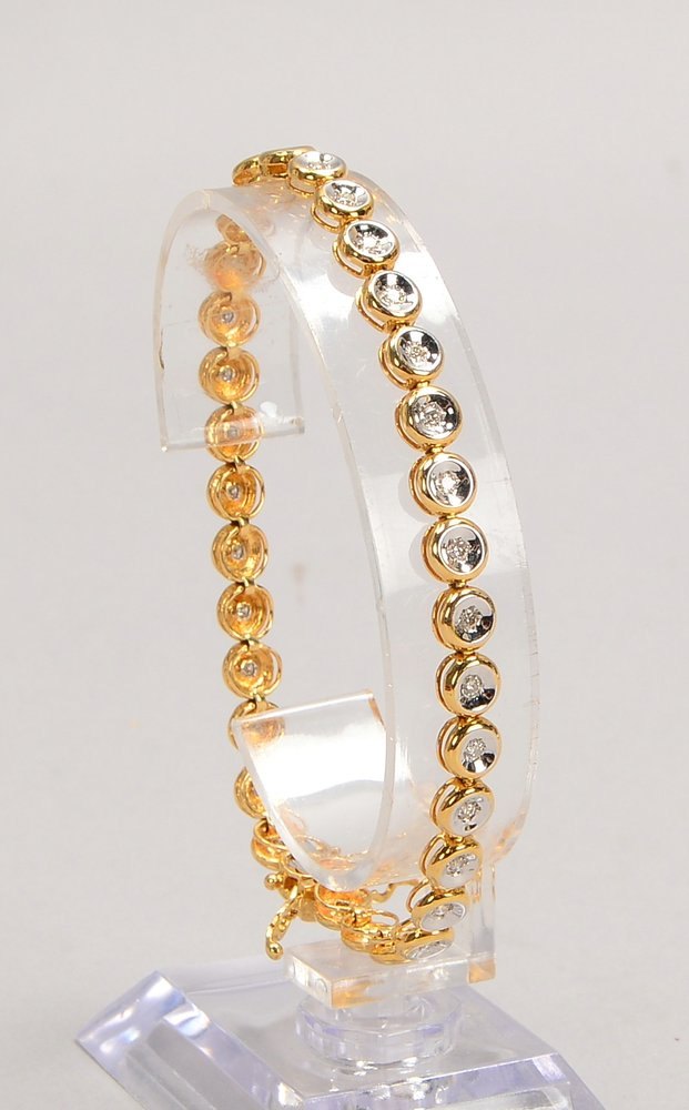 Tennisarmband, 585 GG/WG, mit 33x Diam., mit Sicherheitsschließe; Gew. 11,84 g