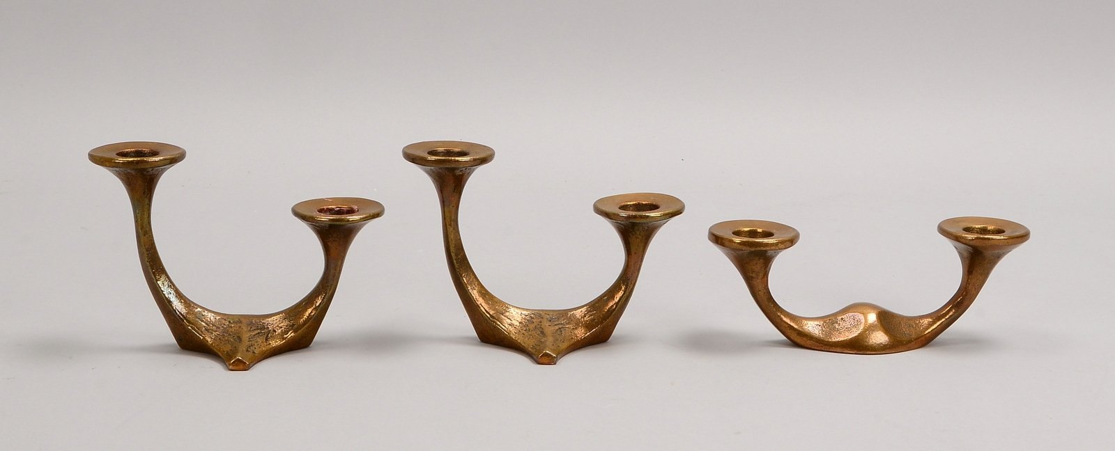 Harjes, 3 Tischkerzenleuchter, Bronze, jeweils 2-flammig, gemarkt; Höhe 6,5 - 11 cm