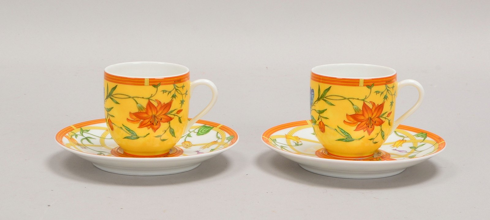 Hermès/Frankreich, 2 Porz.-Tassen mit UT, Dekor 'La Siesta Hermès'; Ø UT 13 cm