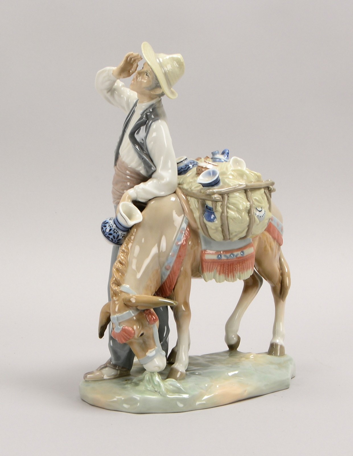 Lladro/Spanien, Porz.-Figur, 'Straßenverkäufer mit Esel', pastos polychr.