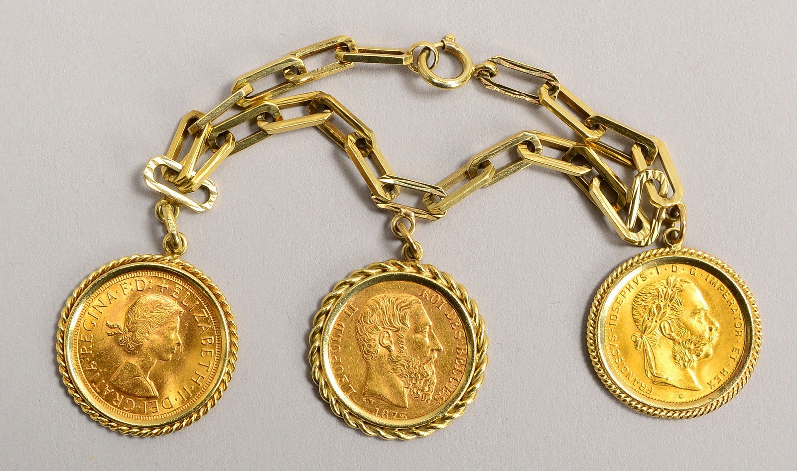 Armband, 585 GG (gest.), 3x Münzen: '1 Sovereign', '20 Francs', '8 Florin'; Gew. 37,50 g
