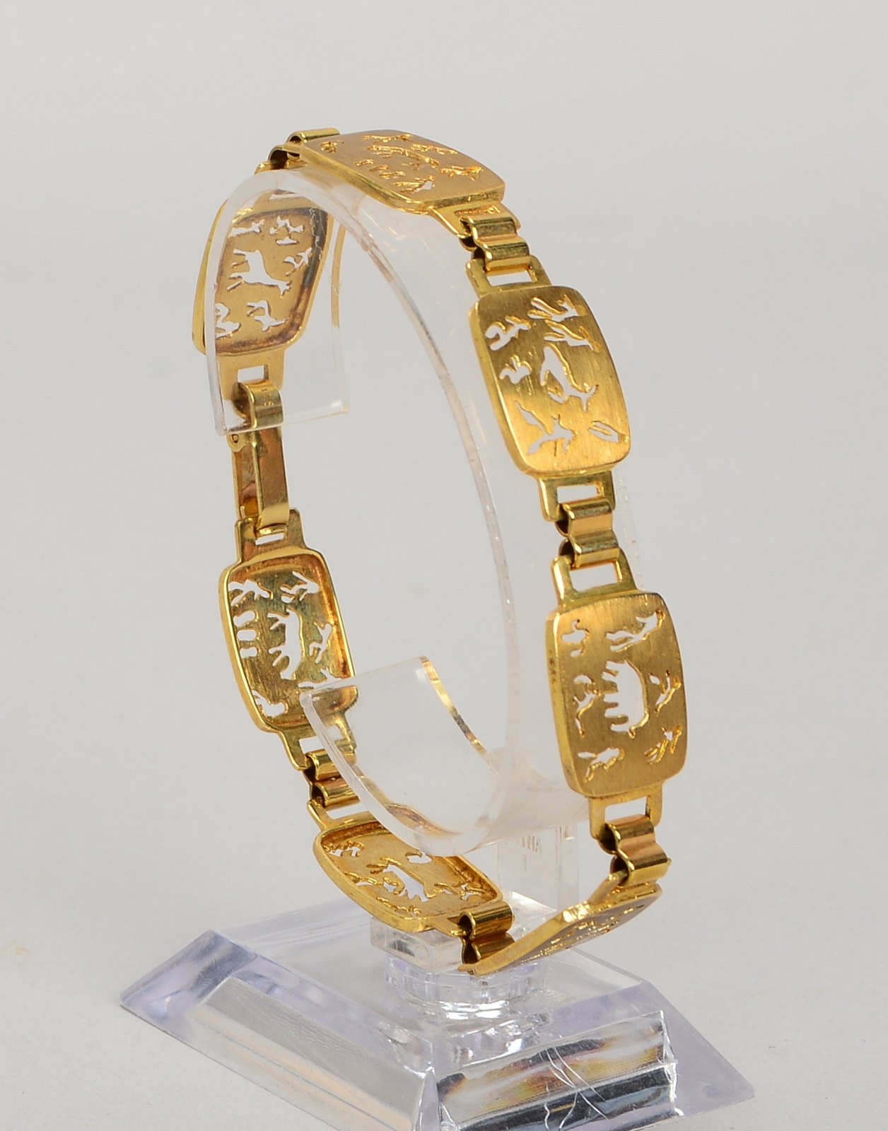 Armband, 375 GG (gest.), Glieder mit untersch. Tiermotiven/geschnitten; Gew. 16 g
