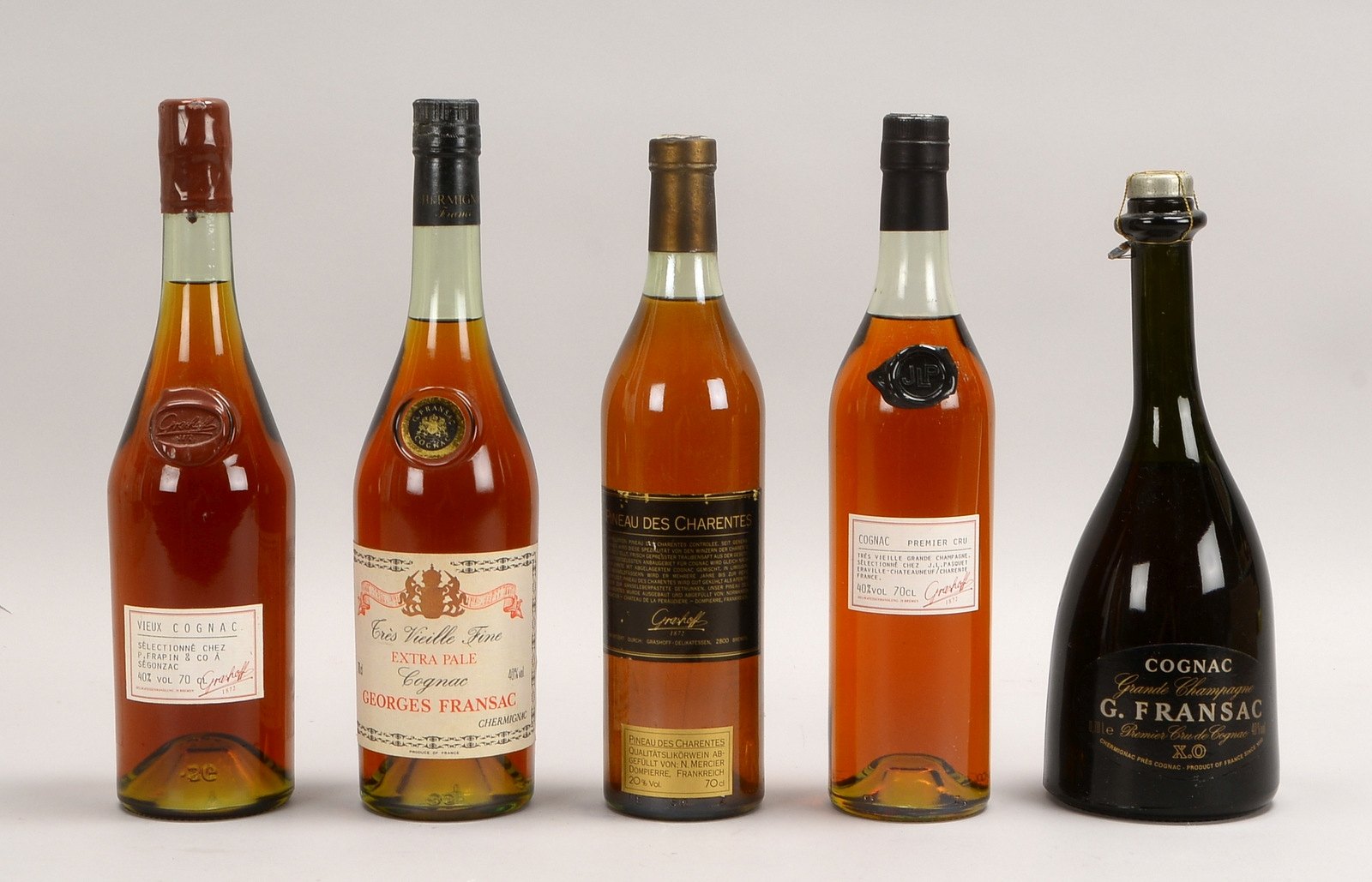 Sammler-Spirituosen, 5 Flaschen: Cognac Georges Fransac, und Grashoff-Cognac