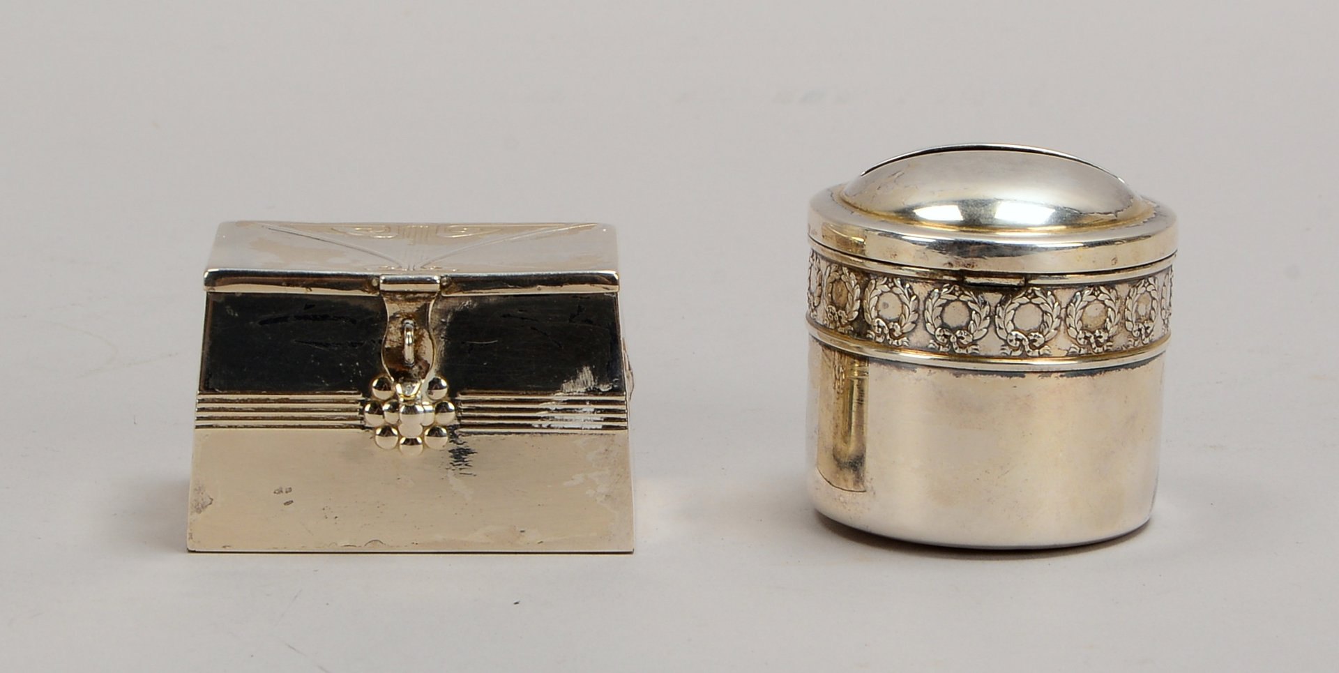 WMF, 2 Sammler-Spardosen, jeweils mit 1/100 Silberauflage; Höhe 4,5 cm/5,5 cm