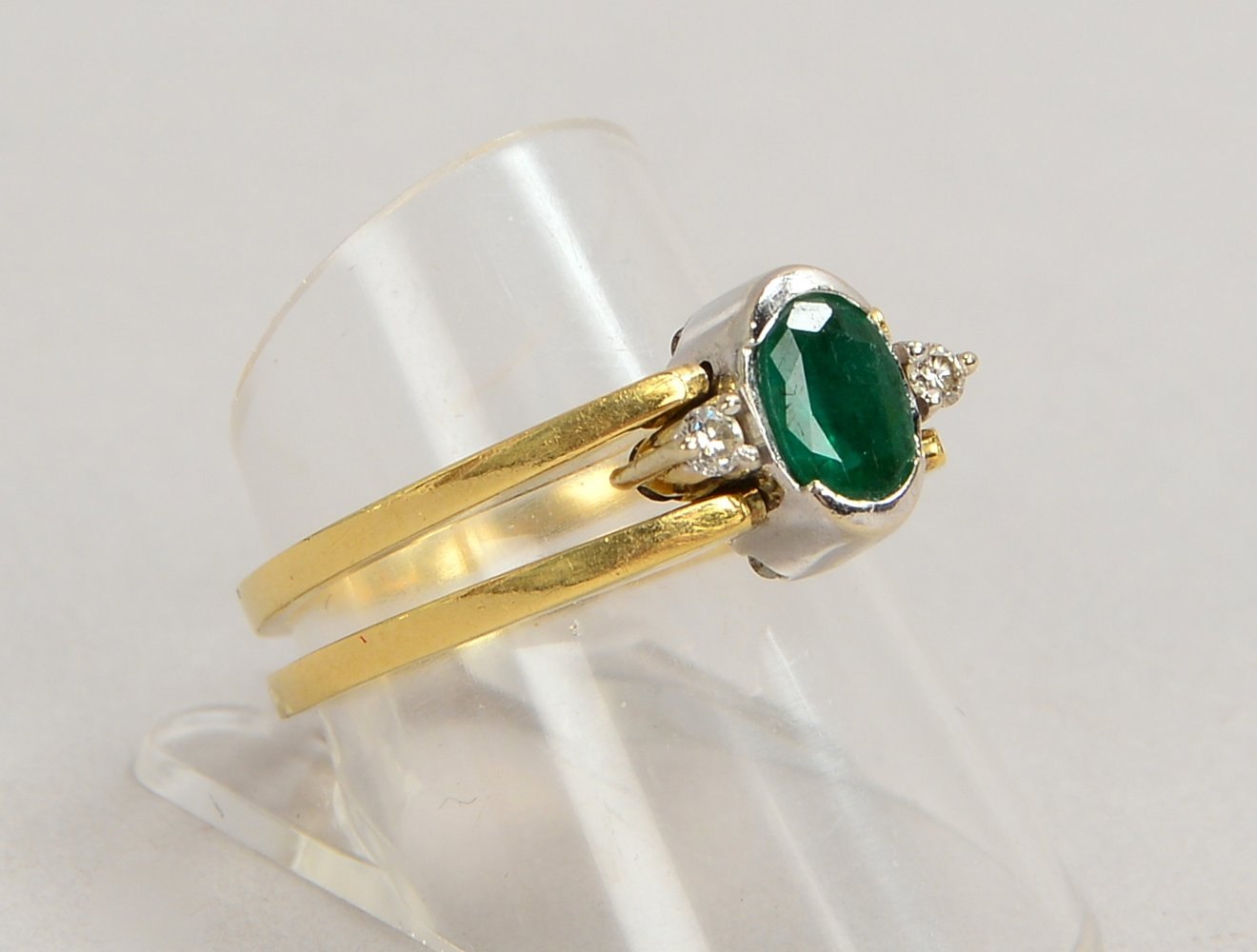 Wechsel-/Wendering, 585 GG/WG, mit Smaragd von ca. 0,38 ct und 17x Brill./2x schwarz