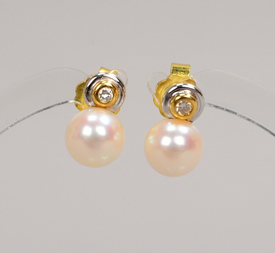 Paar Ohrstecker, 750 GG/WG (gest.), jew. mit Zuchtperle/Ø 7 mm und kl. Brill.; Gew. 3,40 g