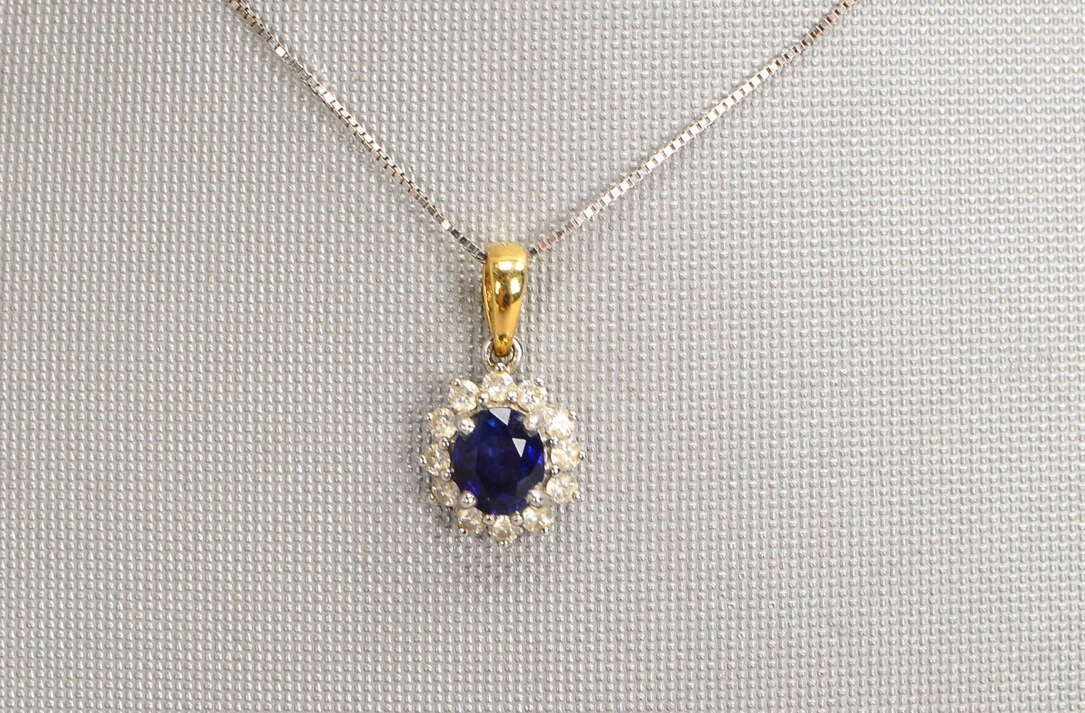 Halskette mit Anh., 750 WG/GG (gest.), Anh. mit Saphir und 12x kl. Brill./zus. ca. 0,24 ct