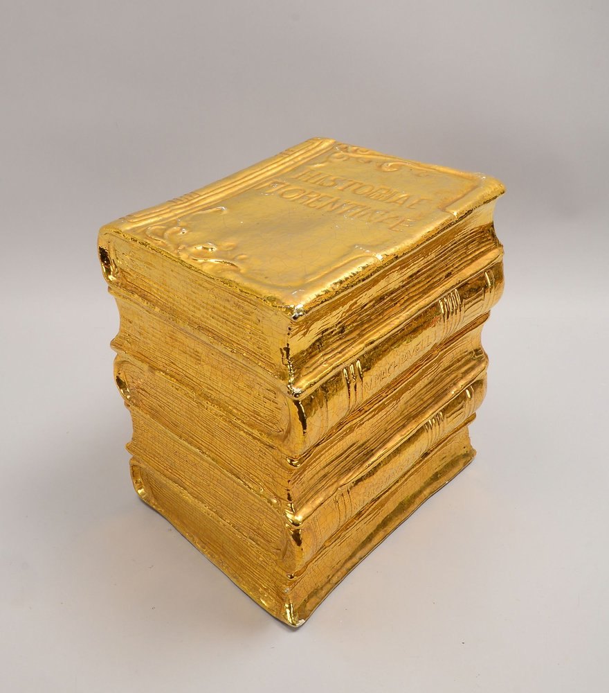 Kl. Beistelltisch, Keramik verg., in Form von 4x übereinanderliegenden Folianten; Höhe 36 cm