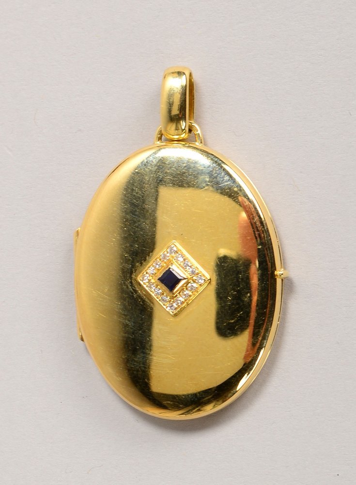 Medaillon-Anh., 585 GG (gest.), oval, mit Entourage aus Saphiren/Diam.; Gew. 20,60 g
