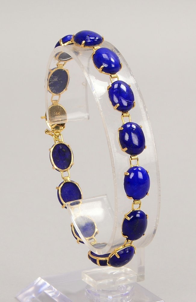 Armband, 585 GG (gest.), mit 13x Lapislazuli-Cab., Steckschl.; Gew. 8,90 g