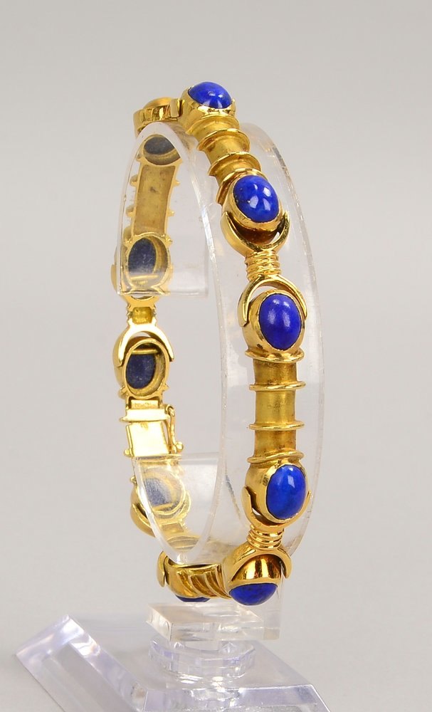 Armband, 750 GG (arab. Punz./gest.), mit 10x Lapis-Cab., Steckschl.; Gew. 32,70 g