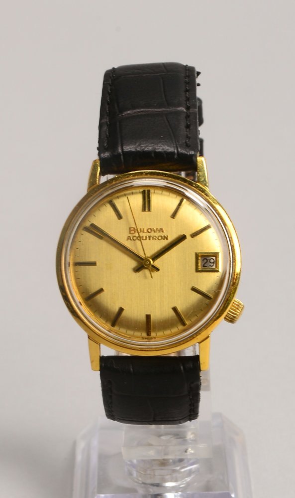 HAU Bulova 'Accutron', 750 GG-Geh., goldf. Ziffernbl., Strichindizes, Datum, Lederarmb.