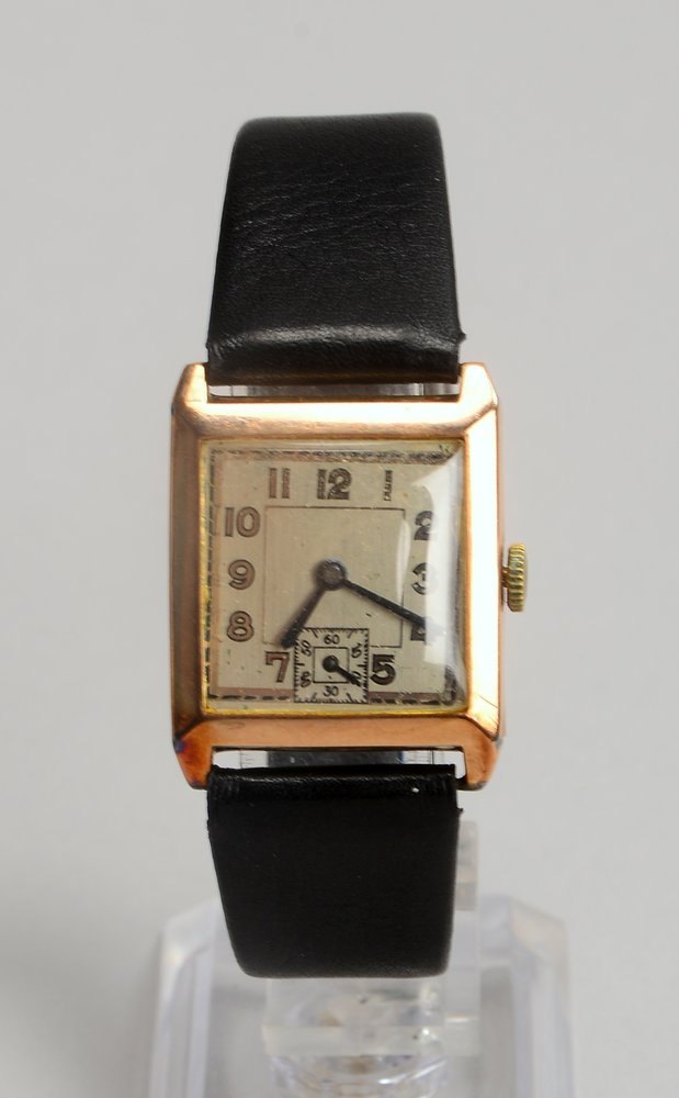 HAU, mit Handaufzug, 375 RG-Geh. an Lederarmband - läuft an; Maße 35 x 32 cm