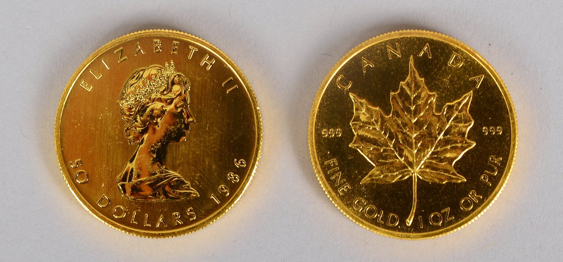 'Maple Leaf - Kanada, 1979', und '50 Dollars - Eliz. II, 1986', je 1 oz Feingold
