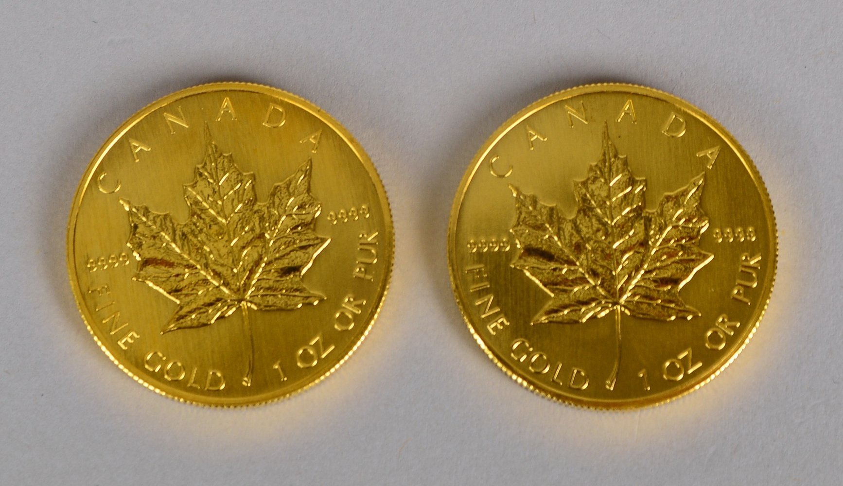 2 'Maple Leaf - Kanada, 1990', und '50 Dollars - Eliz. II, 1990', je 1 oz Feingold