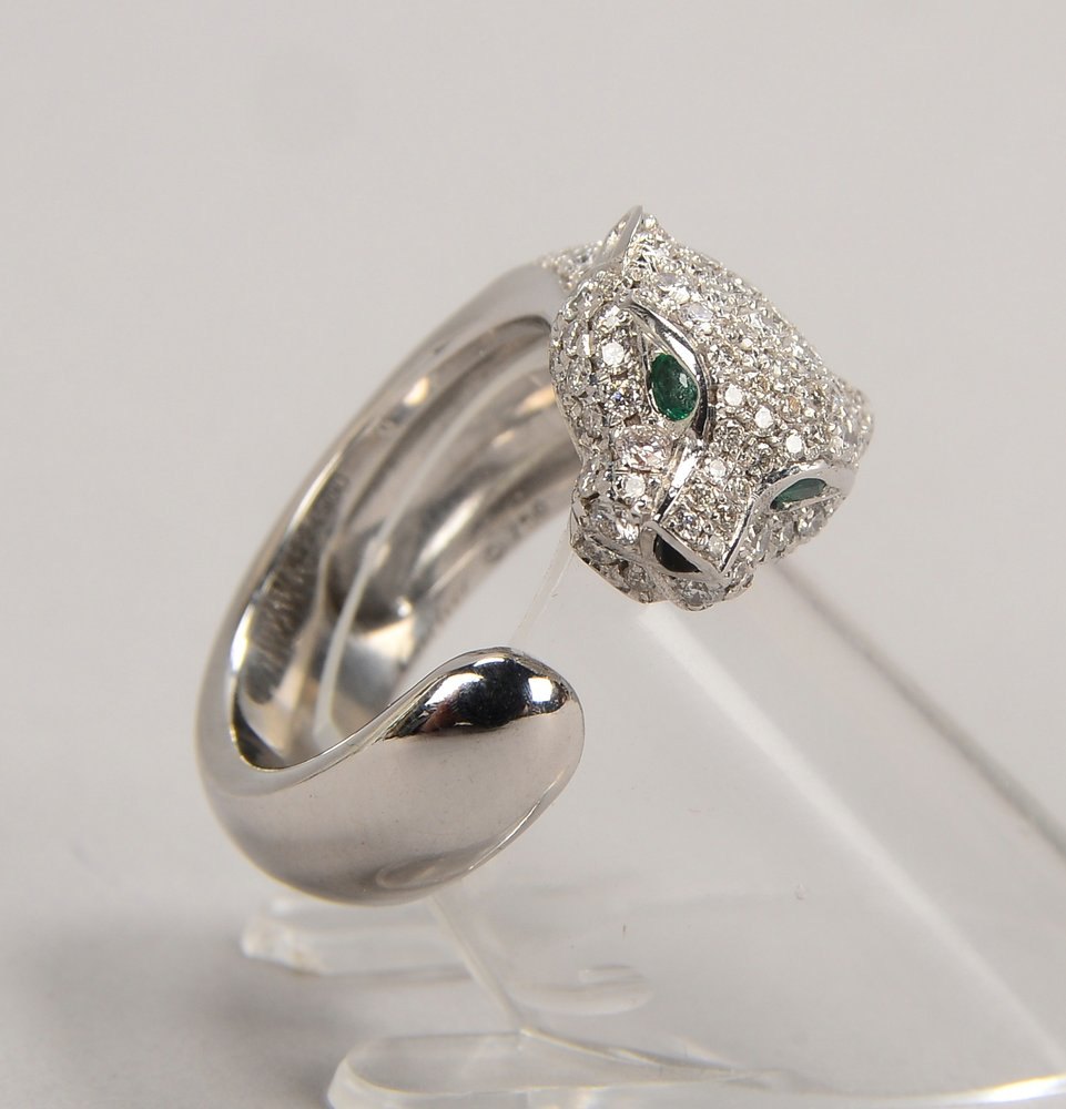 Cartier-Ring, 750 WG (gest.), 'Panthère', Nr. '422 4900', offene Schiene, kl. Brill., Smar., Saphir