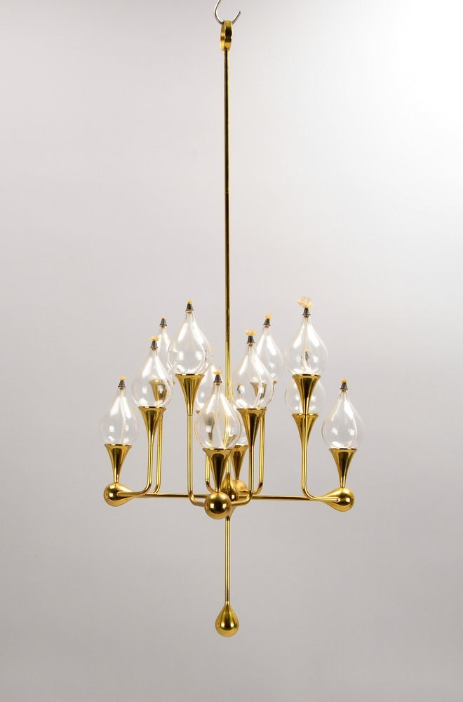 Freddie Andersen, Designer-Petr.-Lampe, Messing, 12-armig/12-fl.; Höhe 87 cm