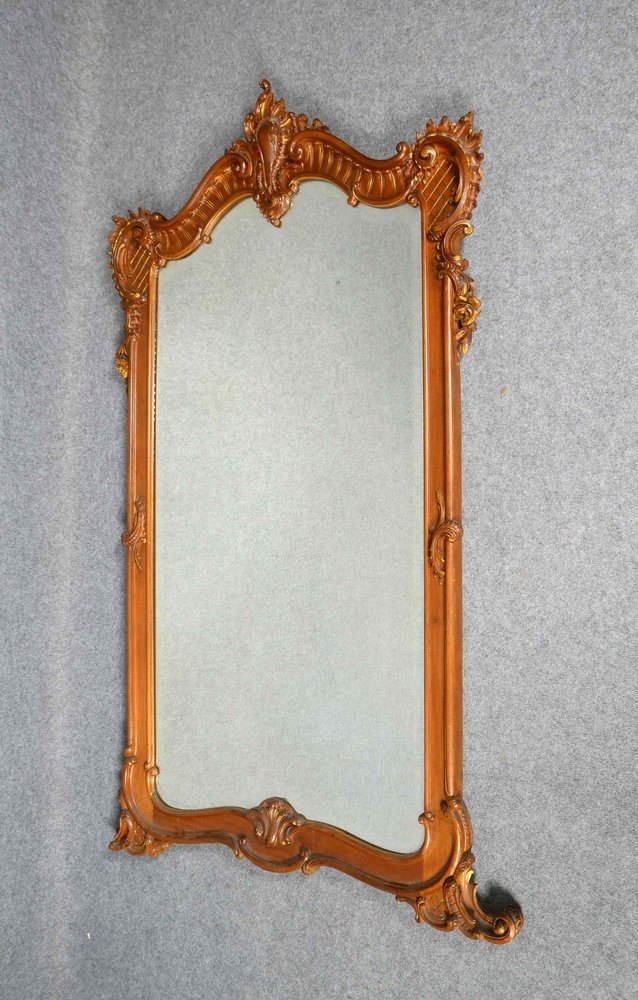 Gr. Wandspiegel, Holz mit Rocaillen-Schnitzwerk, fac. Spiegelglas, Reste von Goldstaff.