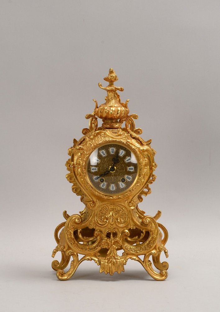Pendule/Kaminuhr, Urgos-Werk, Bronzegeh./verg., gewölbtes Glas, 2x Hämmer auf Gl.