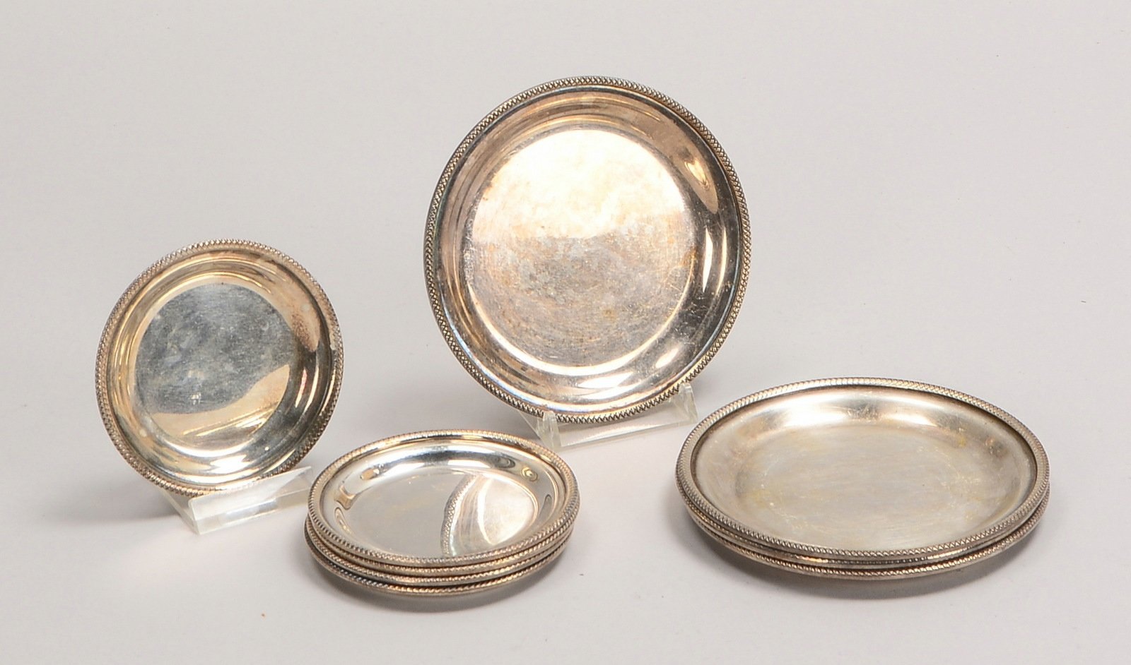 Untersetzer, 925 Sterlingsilber: 4x Flaschen-, Ø 11 cm, 5x Glas-, Ø 8 cm; Gew. 535 g