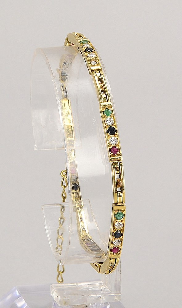 Armband, 585 GG (gest.), mit Saphiren, Rub., Smar., Zirkonen; Gew. 10,90 g (Stein fehlt)