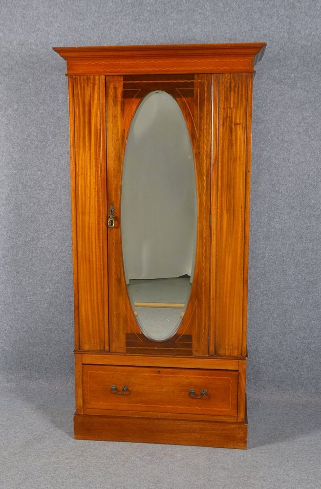 Kleiderschrank, Mahagoni/teils intaris., 1-schüb./1-türig, mit ovalem Spiegel; Höhe 181 cm