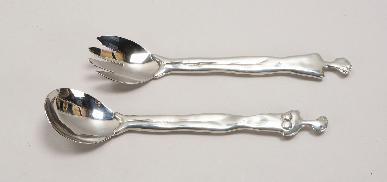 2-tlg. Salatbesteck, Edelstahl-Laffe/Zinken, figürl. Zinnstiel, Entw. Carrol Boyes