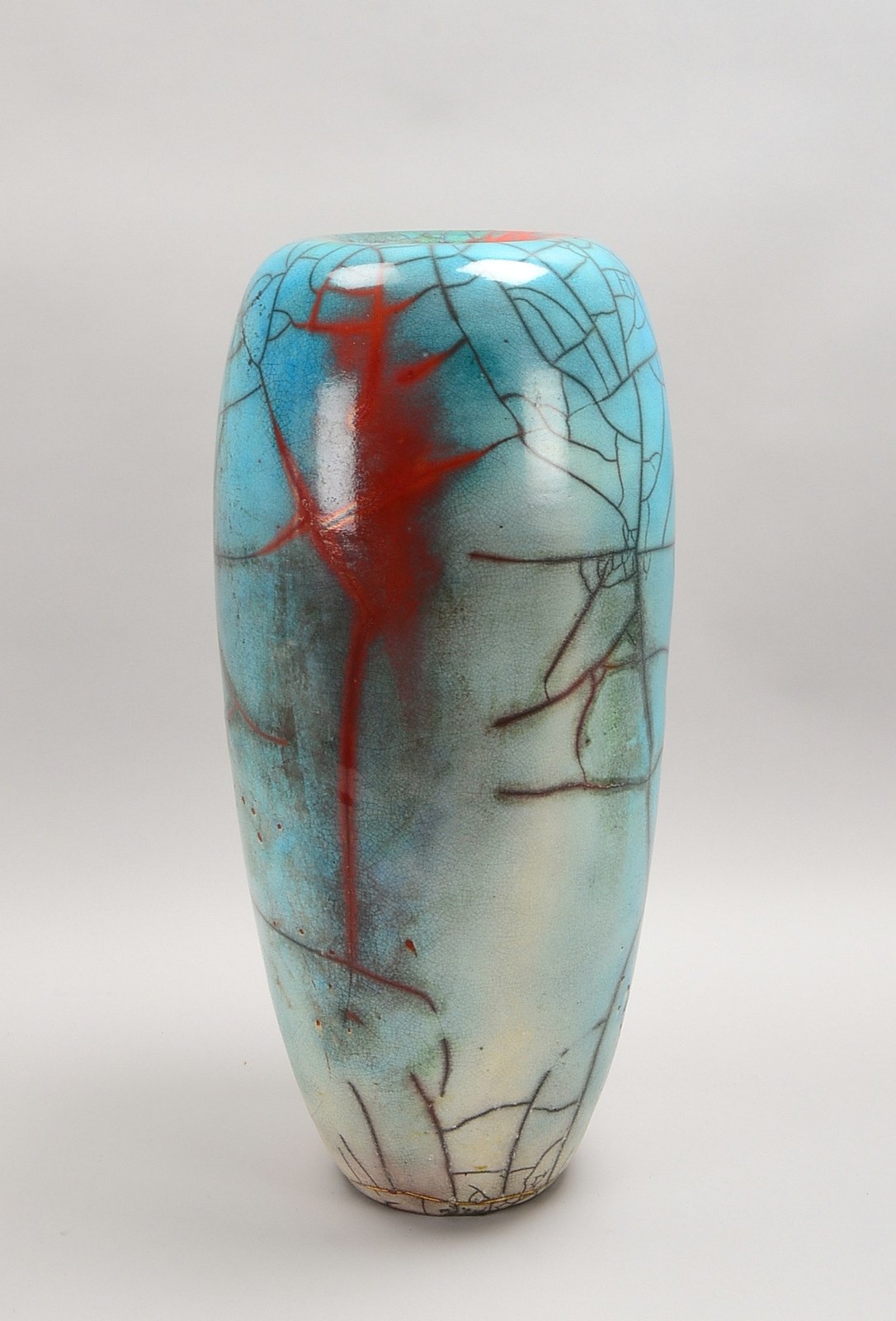 Mindermann, M., Künstlerkeramik, gr. Bodenvase in Raku-Technik, kupferf./türkisf. glas.