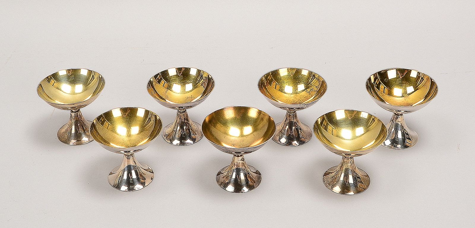 Wilkens, 7x Likörschalen, 830 Silber/innen restverg.; Höhe 6 cm, Gew. 356 g
