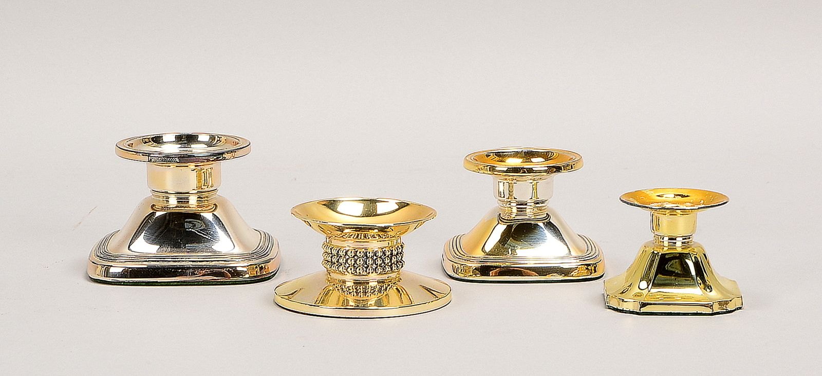 4 Tischkerzenleuchter, 925 Sterlingsilber, versch. Ausf. - gefüllt!; Höhe 4 cm - Höhe 5 cm