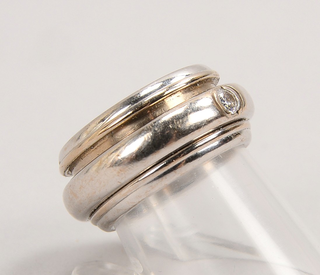 Piaget, Drehring, 750 WG/Platin, Nr. 'A92255', mit kl. Diam./ca. 0,13 ct; RG 53, Gew. 19,80 g
