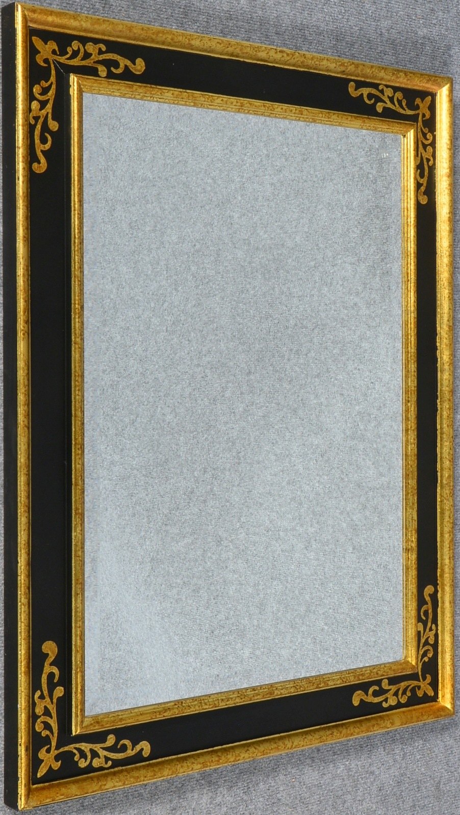Wandspiegel, facettiertes Spiegelglas, im teilvergoldeten Rahmen; Maße 86 x 66 cm