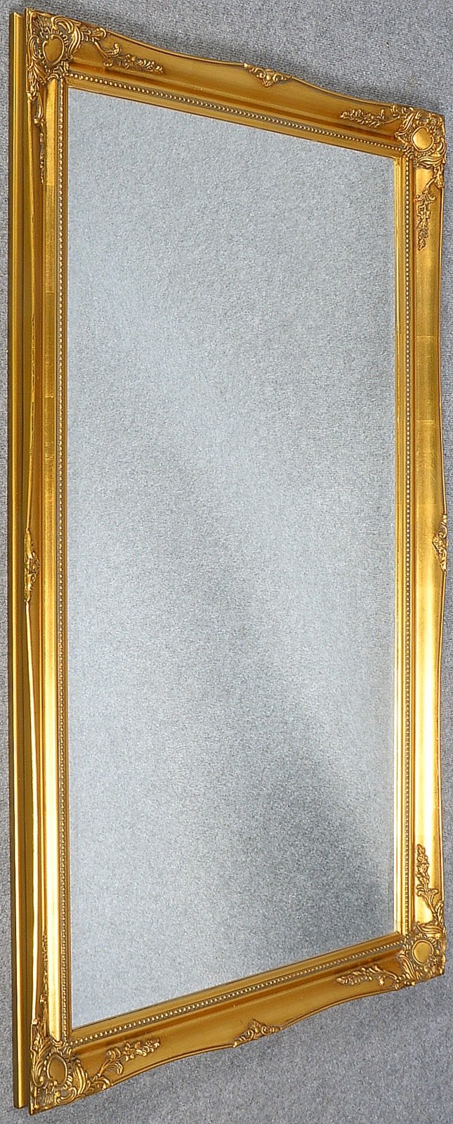 Wandspiegel, facettiertes Spiegelglas, im Goldrahmen; Maße ca. 134 x 73,5 cm