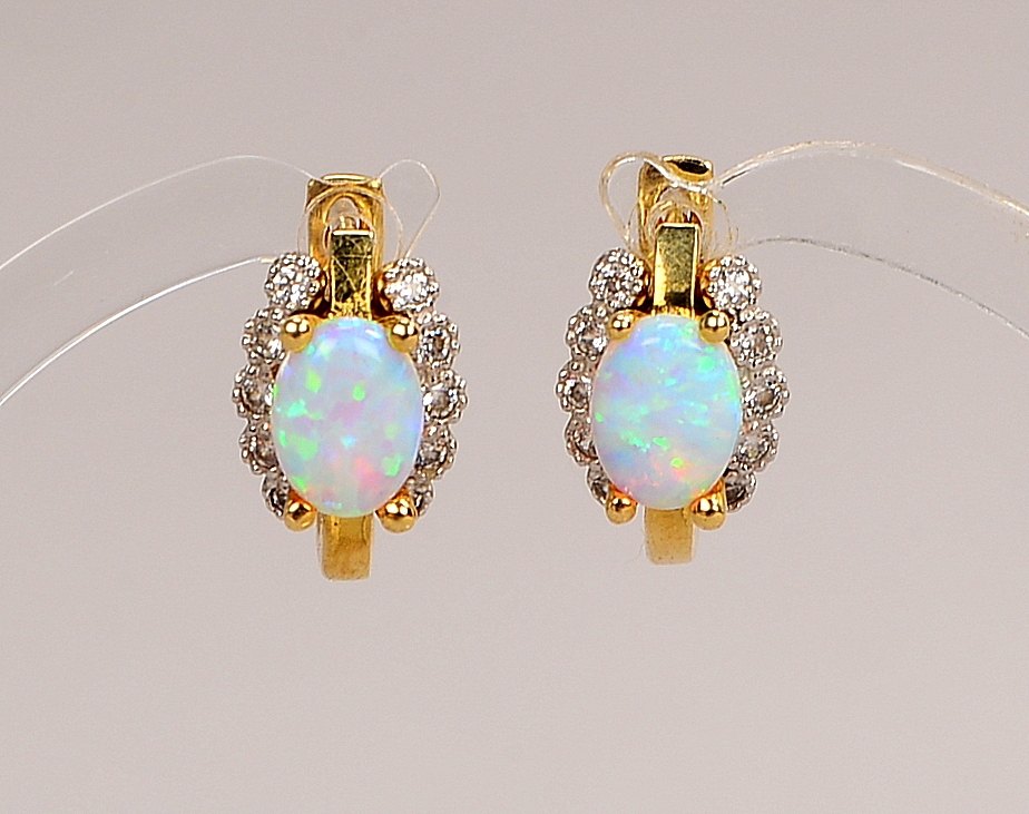 Paar Ohrstecker, 585 GG/WG (gest.), jeweils mit Opal und 10x kl. Brillanten; Gew. 5,10 g