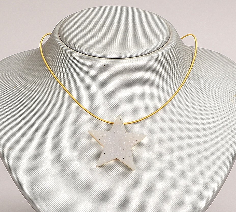 Niessing, Designer-Collier, 750 GG (gest.), Spiral-Halsreif mit figürlichem Anh. 'Stern'