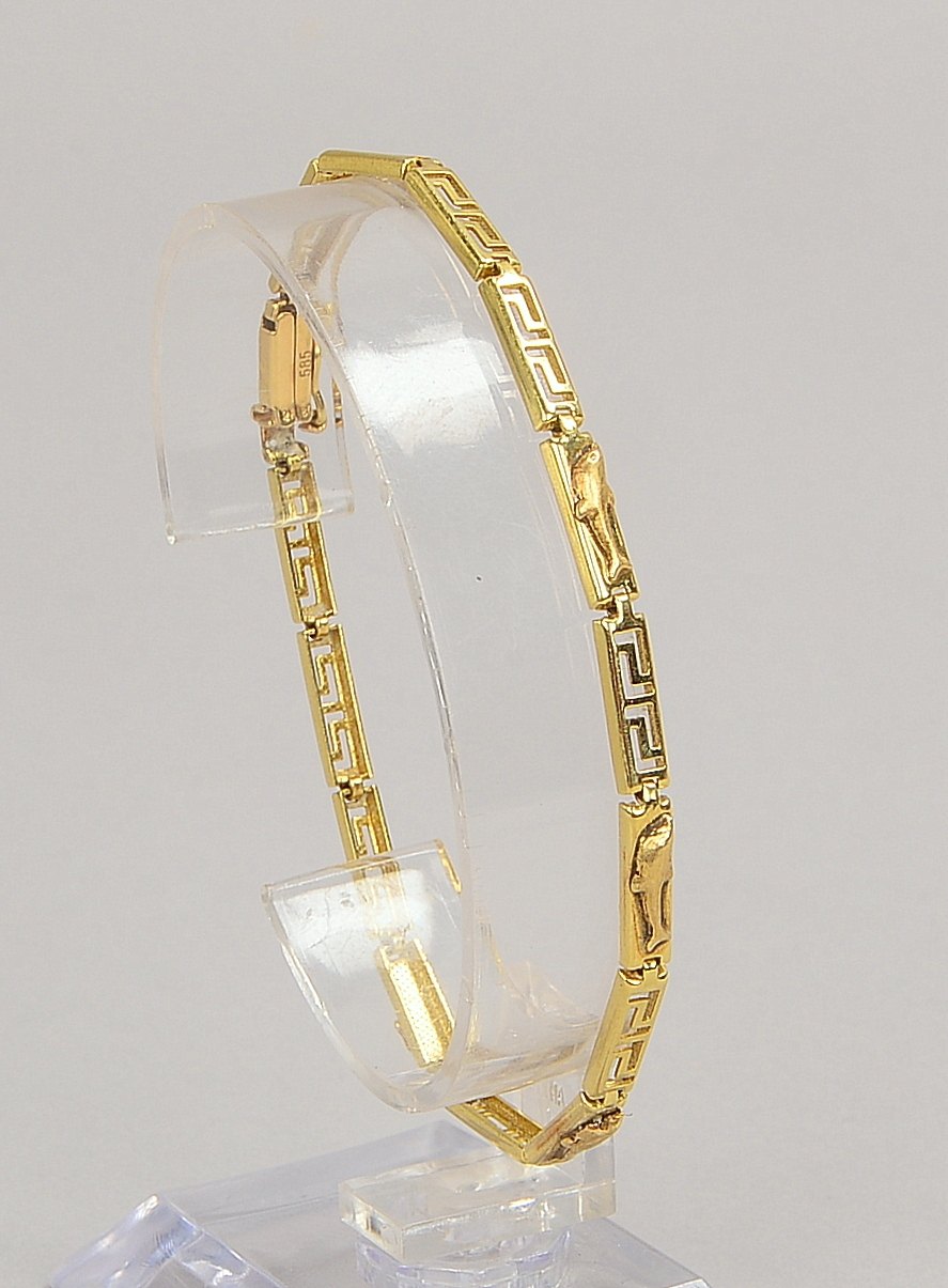 Armband, 585 GG (gest.), Glieder in Mäanderoptik durchbrochen, figürliche Motive