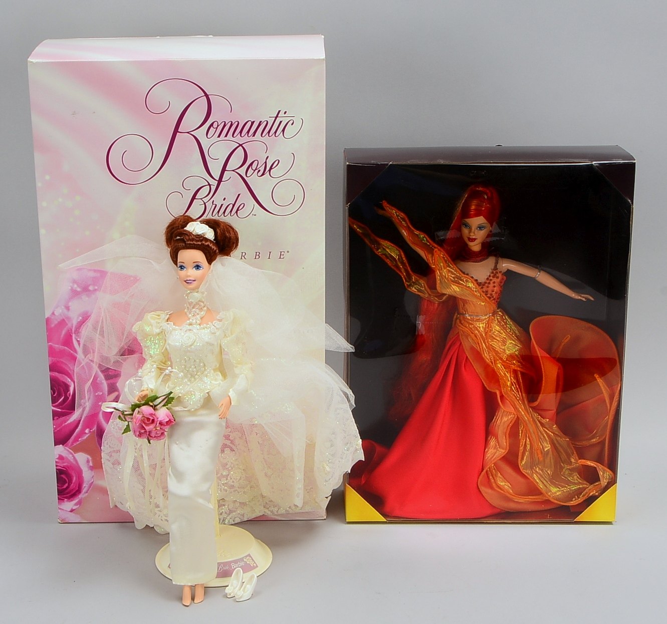 Mattel, 2 orig. Barbie-Puppen: 1x 'Dancing Fire', und 1x 'Romantic Rose Bride'