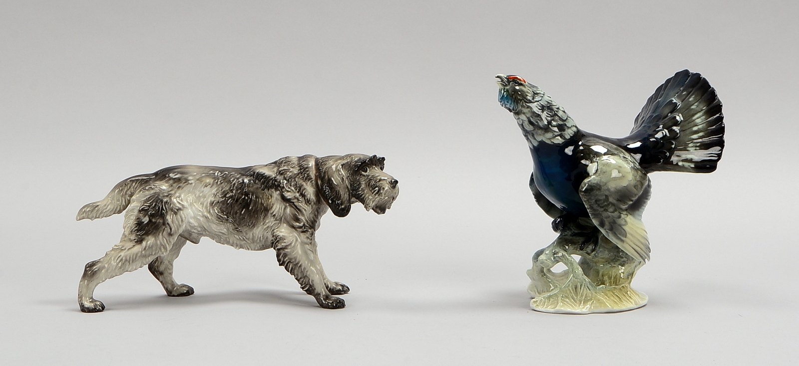 Rosenthal, 2 Porz.-Figuren: 'Terrierhund', Höhe 11 cm, und 'Auerhahn', Höhe 16,5 cm